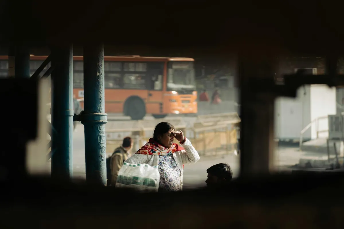 A crowded morning bus stop in Havana